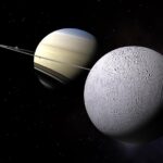 A digital render of Enceladus, Saturn’s icy moon, positioned against the planet Saturn and its rings, showcasing the moon’s small, bright form in the vast Saturn system