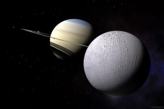 A digital render of Enceladus, Saturn’s icy moon, positioned against the planet Saturn and its rings, showcasing the moon’s small, bright form in the vast Saturn system