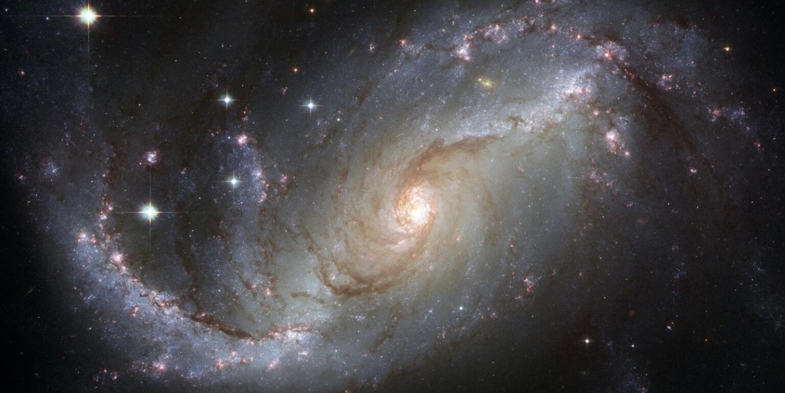 Capture of the NGC 1672 spiral galaxy showcasing its majestic spiral arms and bright core.