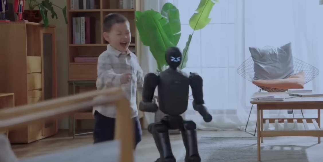 AgiBot's PrimeBot small humanoid robot playing with a kid