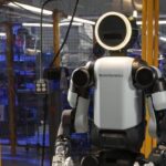 Boston Dynamics Atlas humanoid robot standing in full view, showcasing advanced mobility and humanoid design