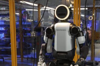 Boston Dynamics Atlas humanoid robot standing in full view, showcasing advanced mobility and humanoid design